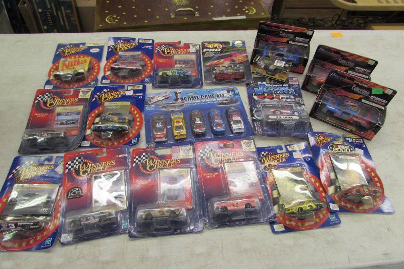 lot 390 image: COLLECTION OF DALE EARNHARDT AND DALE JR COLLECTOR CARS