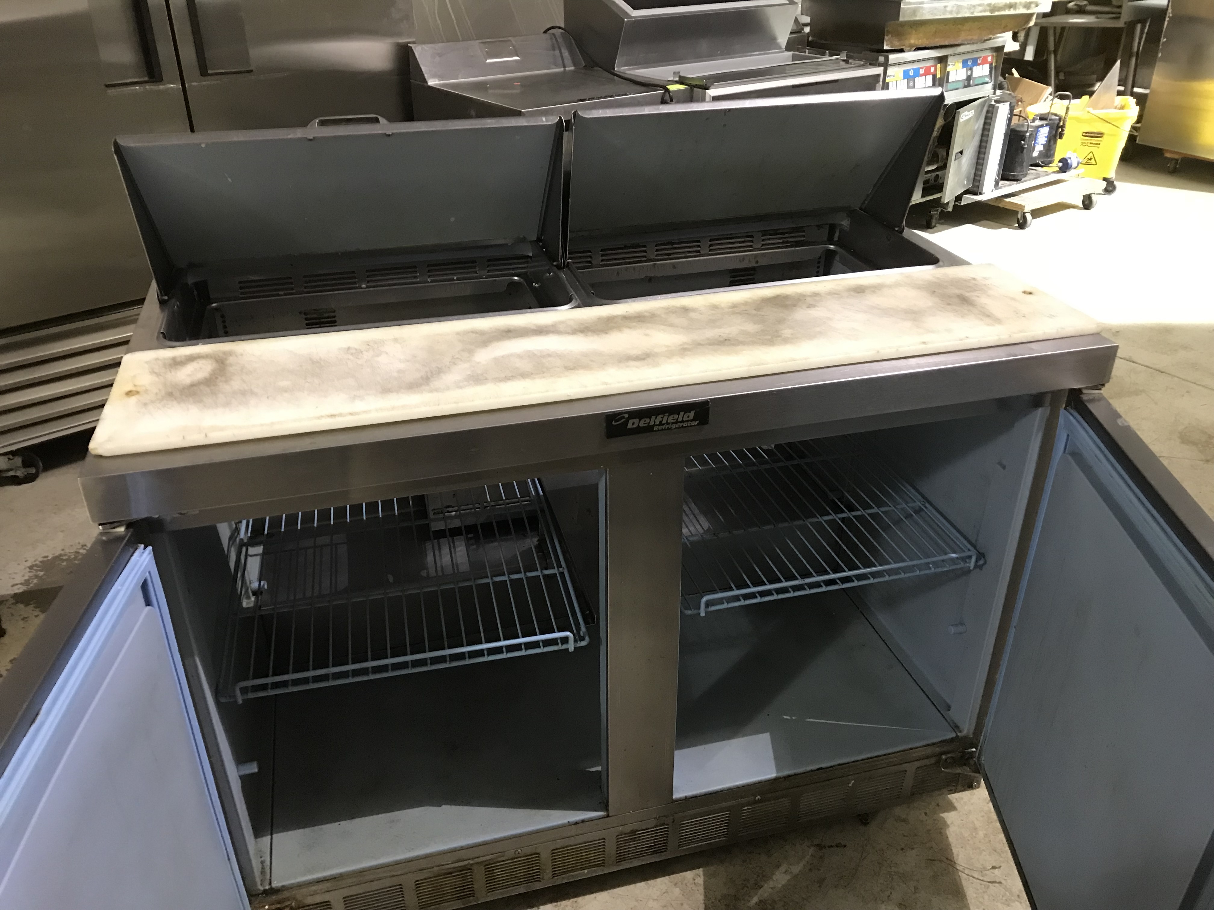 lot 26 image: Delfield 4448N-12 (ser #0810152000551) self-contained portable stainless steel 2-door prep cooler Runs Cools