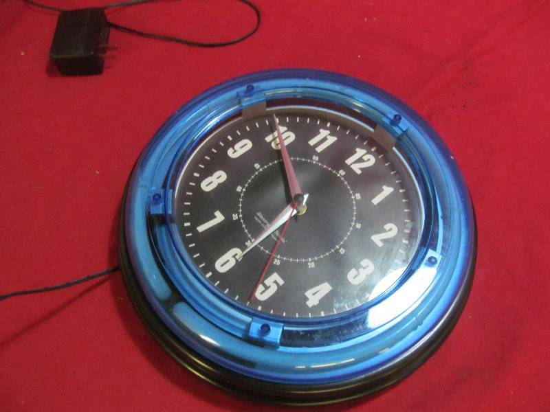 lot 69 image: Sterling and Noble Neon light wall clock