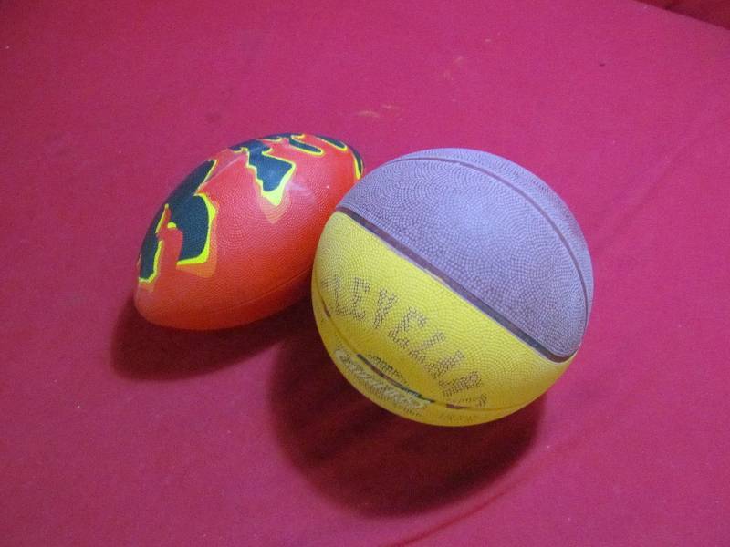 lot 73 image: basketball, football