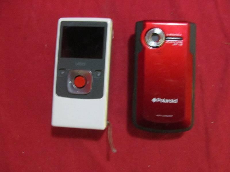 lot 123 image: Polaroid camera, flip camera