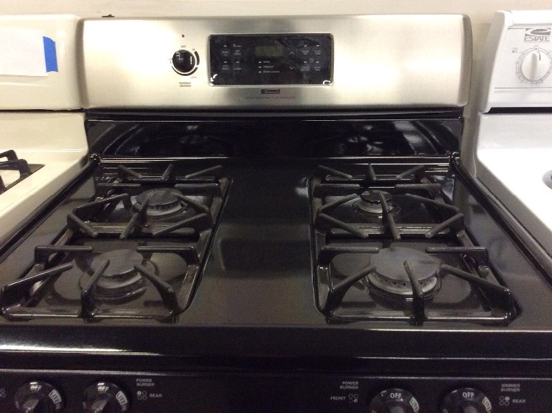 lot 5 image: Kenmore Stainless Steel Four Burner Gas Stove