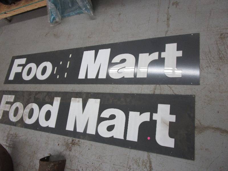 lot 24 image: 2 Food Mart metal signs
