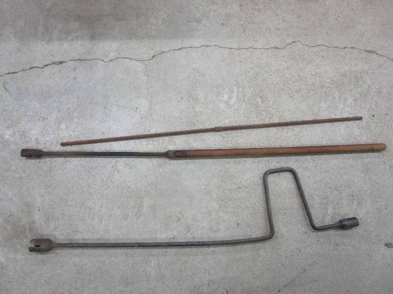 lot 136 image: Antique Pieces longest one is 59 has wood Handle