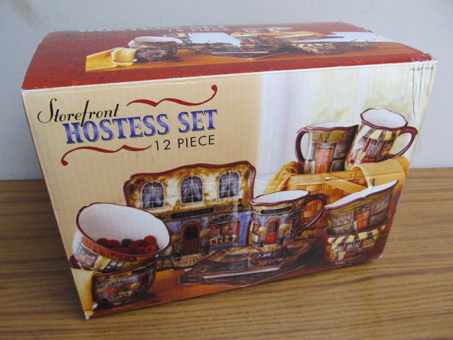 lot 66 image: NIB 12 Piece Storefront Dish Set