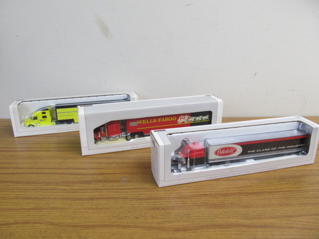 lot 87 image: 3 NIB 164 Scale Diecast Metal Semi Trucks