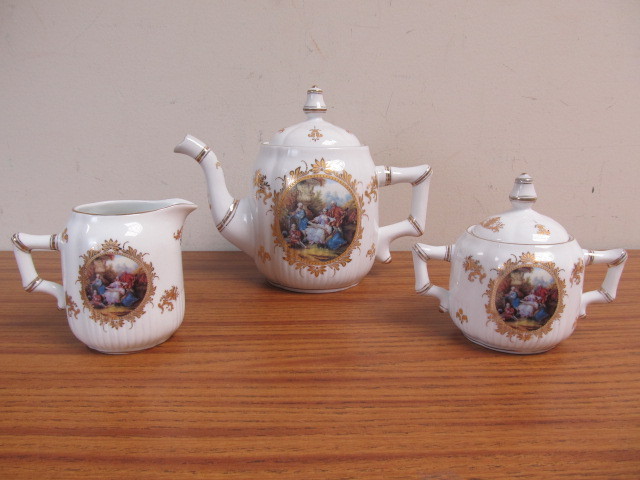 lot 117 image: Limoges Porcelain Teapot Cream & Sugar Set