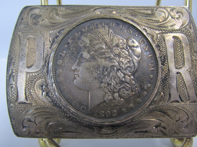 lot 161 image: Vintage Sterling Silver THE WESTERNER Belt Buckle w 1892 Silver Dollar