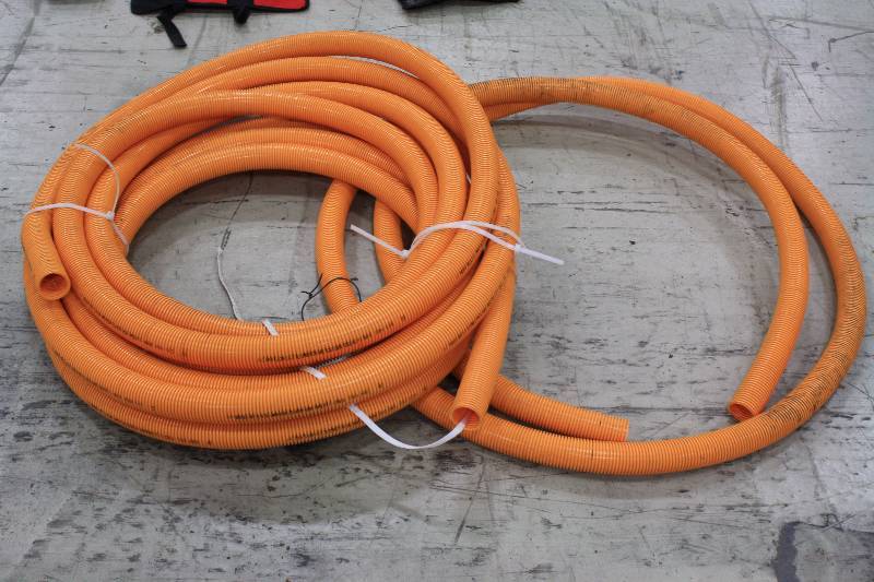 lot 243 image: Orange roll of 1.5 Plastic Tubing
