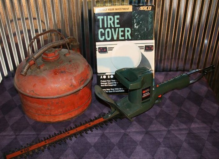 lot 85 image: Gas Can, Hedge Trimmer, and Tire Cover
