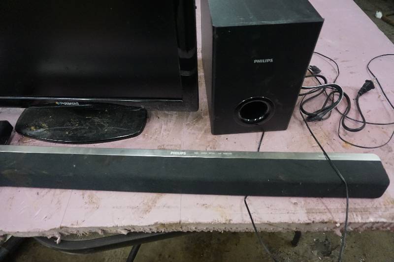 lot 71 image: Polaroid 22 Flat Screen TV With Philips Sound Bar and Router