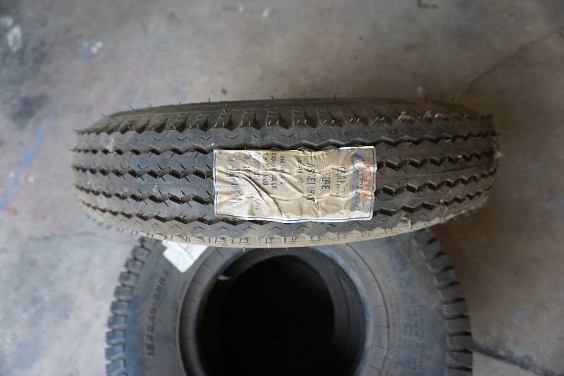 lot 14 image: Load Star Trailer Tire Mounted on 5 Bolt Rim