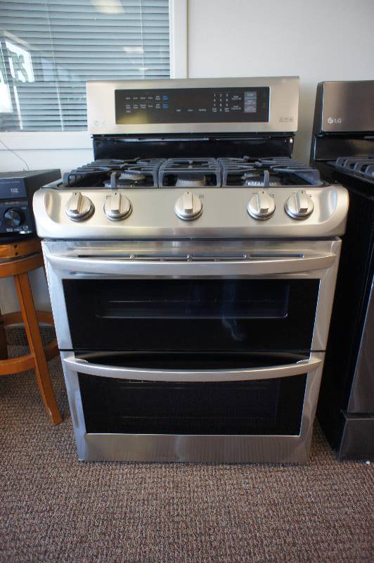 lot 15 image: NEW - SCRATCH AND DENT - LG MODEL # (LDG4315ST) -Propane Gas Double Range - Freestanding - 6.9 cu ft - Stainless Steel - TESTED WORKS - MSRP $ 1999.99
