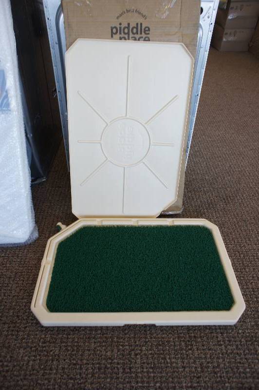 lot 24 image: New, PetSafe Piddle Place IndoorOutdoor Dog Potty System
