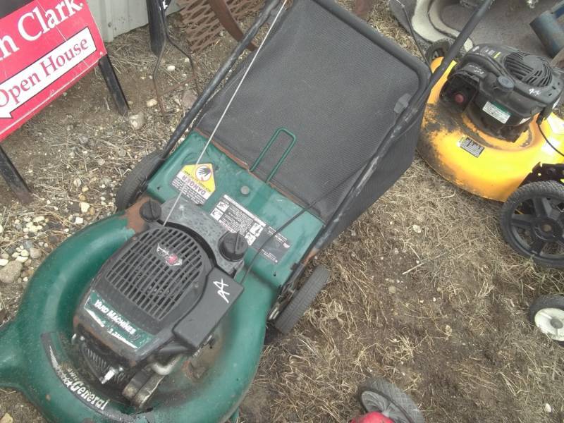 lot 144 image: Push mowers for parts and repair Yard Machines Green and yellow