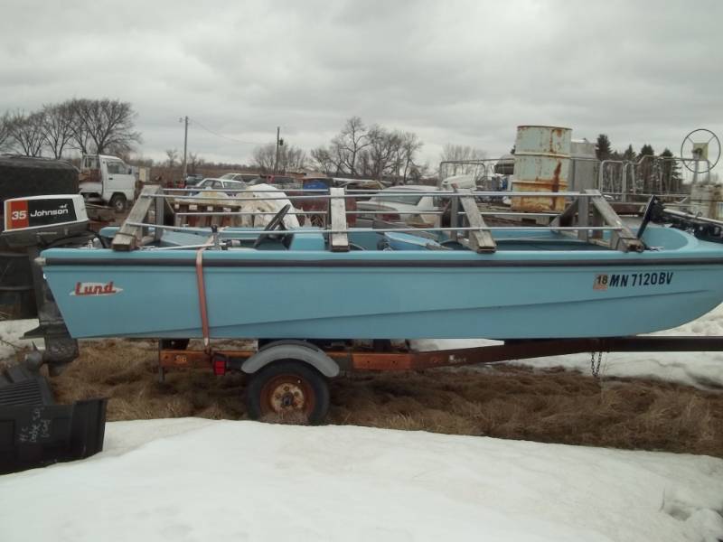 lot 2 image: 1973 Lund boat and Trailer with 35 HP Johnson