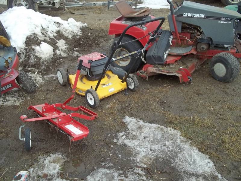lot 29 image: Mowers for parts or repair with Thatcher and Bike