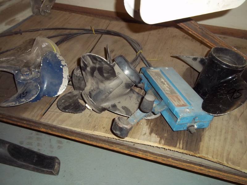 lot 95 image: Boat Props and Evinrude Controls