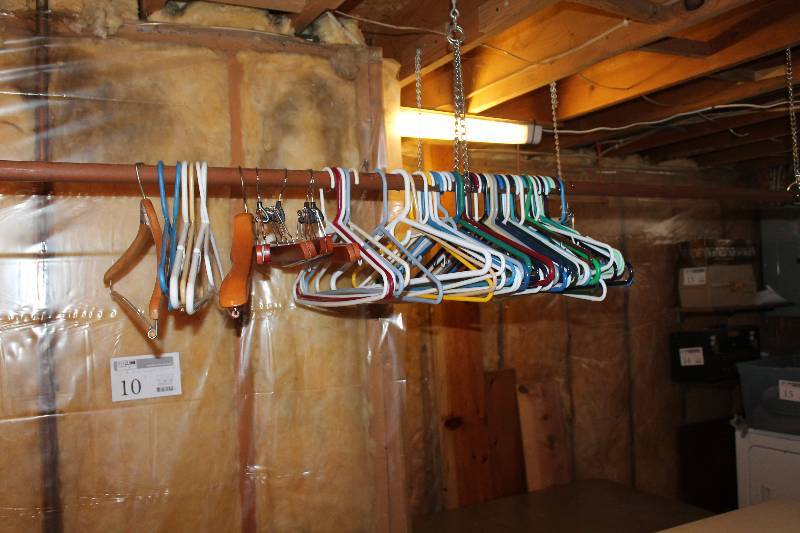 lot 10 image: Closet Rod w Plastic Clothes Hangars