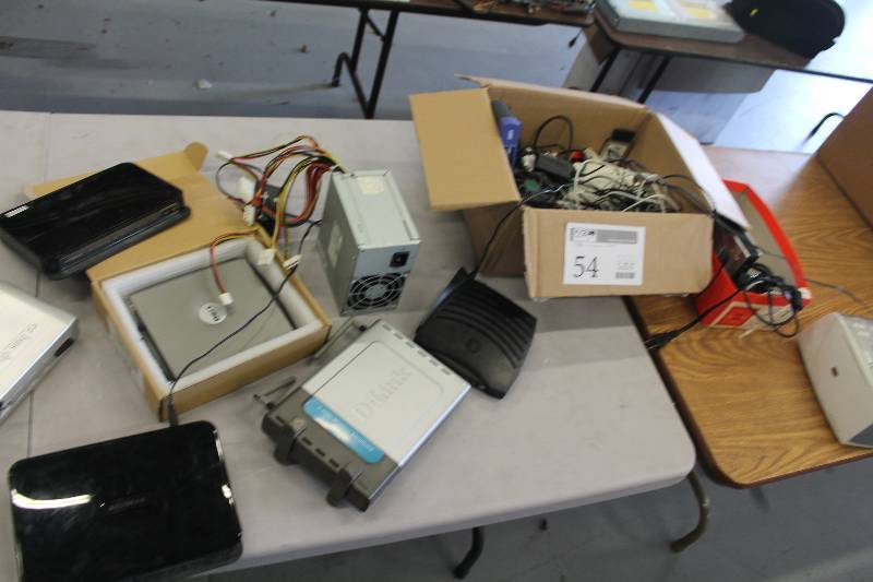 lot 54 image: Netgear Dual Band Wireless-N Gigabit Router, D-Link 2.4GHz Wireless Broadband Router, Motorola Surfboard SB5101 Cable Modem, HP Photosmart 375 Printer, Linksys 10100 5-Port Workgroup Switch, Cables