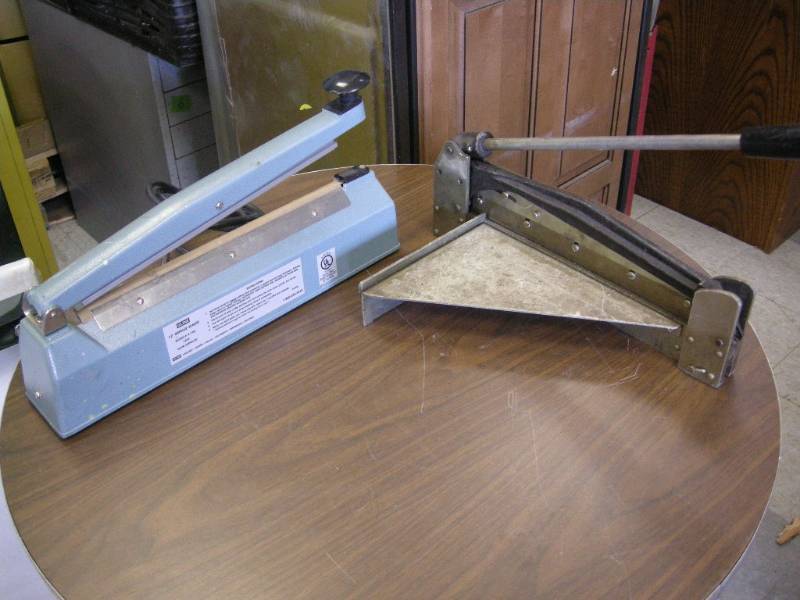 lot 68 image: Uline Impulse Sealer and a Cutting Machine