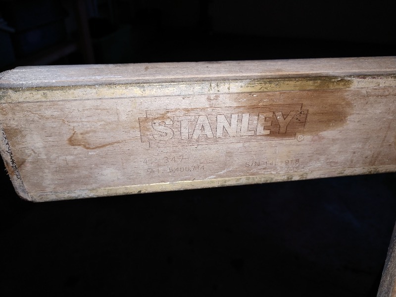 lot 65 image: Yellow Stanley Level, Green Folding Shovel, Heavy Duty Pegboard Hooks