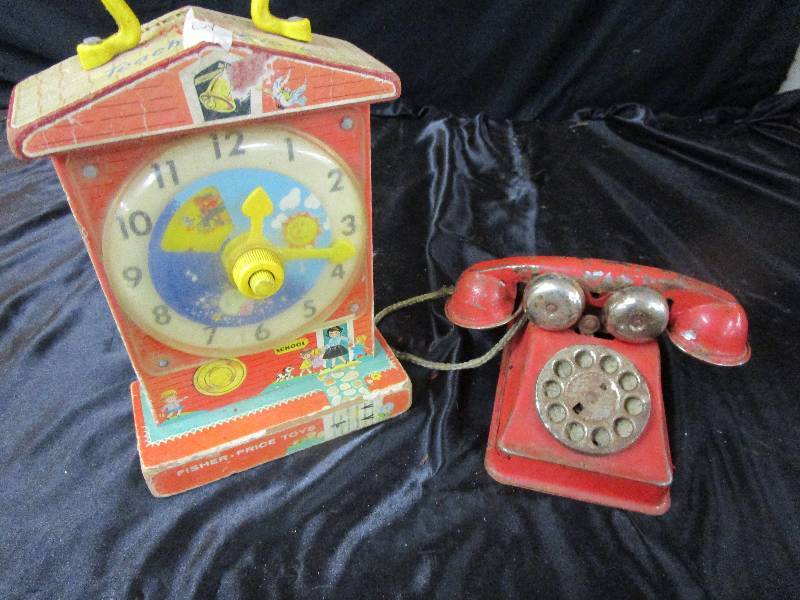 lot 36 image: John Deere Metal Backhoe with Missing parts, Fisherprice Clock andKids  Vintage Metal Phone