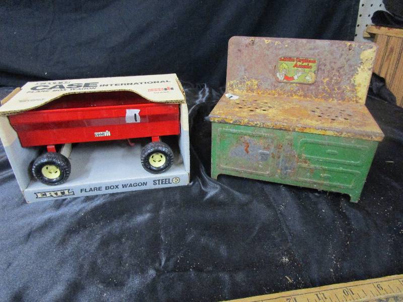 lot 49 image: Ertl Flare Ox Wagon Metal. Little orphan Annie Play Stove
