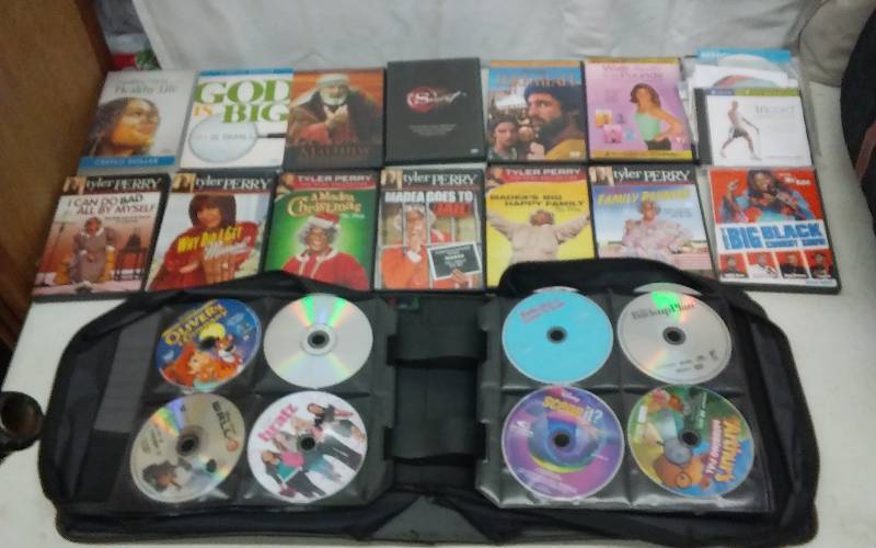 DVD Organizer, With Assorted DVDs, All Ratings, No Cases-Comedy, Religious, Work Outs