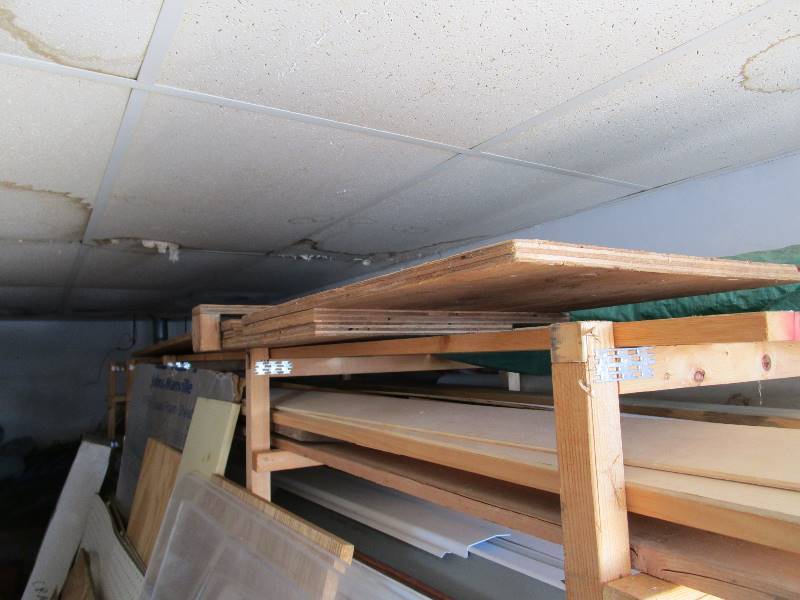 lot 150 image: Wooden Shelving  Contents (less RV awnings)