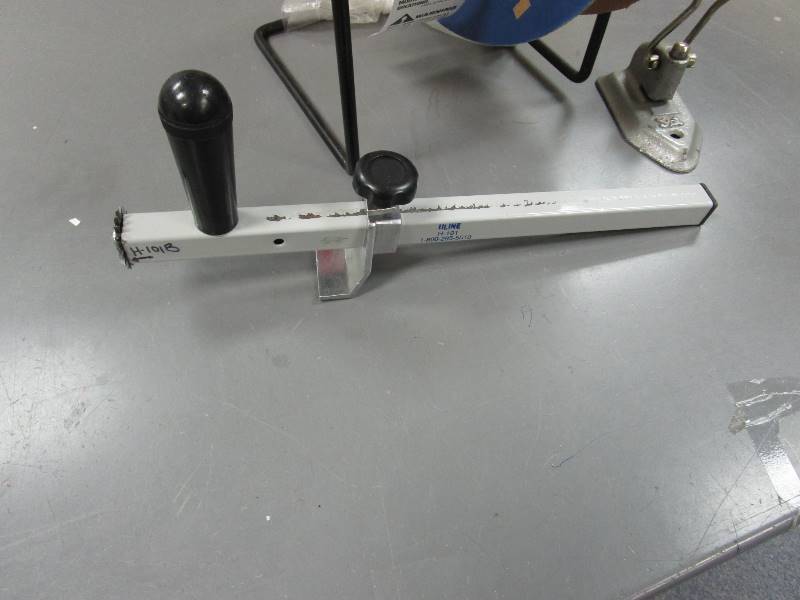 lot 37 image: Uline Dispenser, Cardboard Cutter, Punch