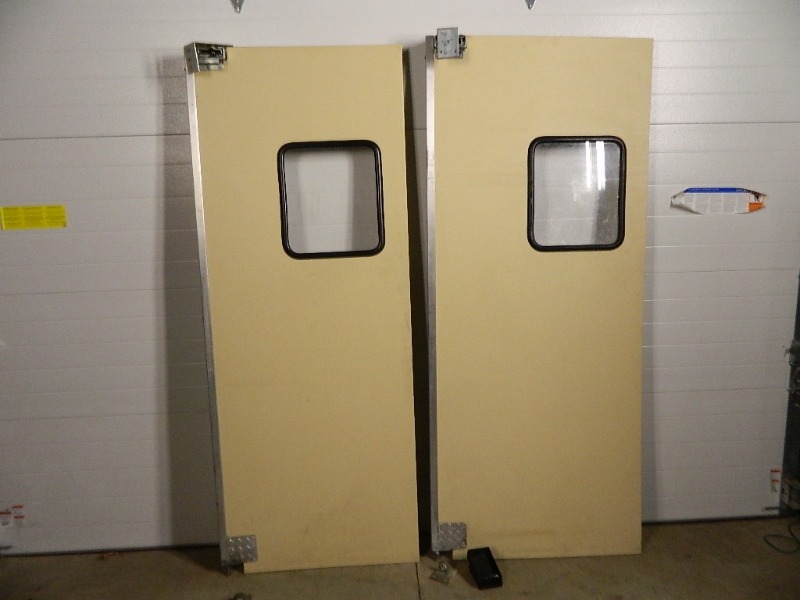 lot 61 image: 2 Swinging Poly Kitchen Doors