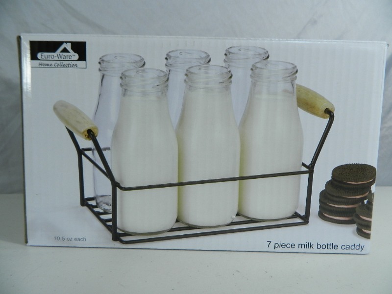 lot 59 image: New 7 Piece Milk Bottle Caddy