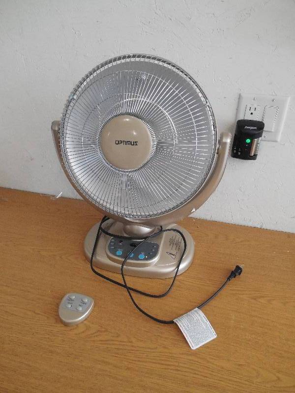 lot 69 image: Optimus 14 Oscillating Radiant Dish Heater with Remote