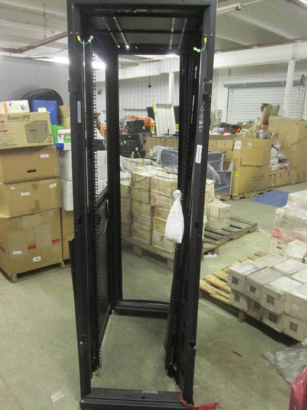 lot 51 image: APC heavy duty rack on wheels...