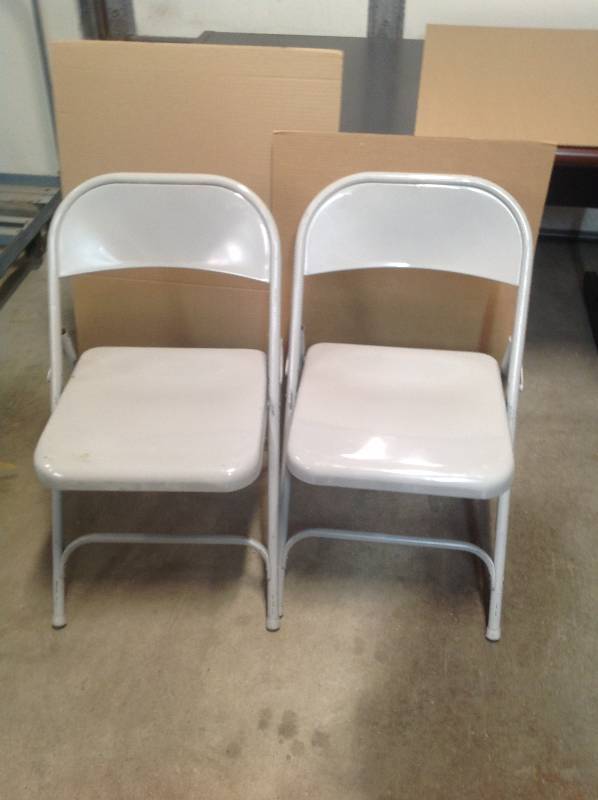 2 metal folding chairs.