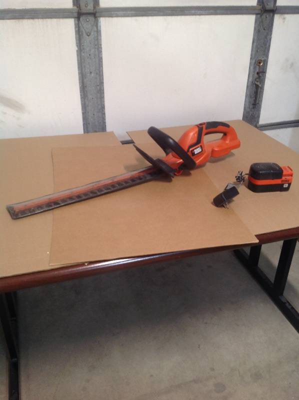 18v Black and Decker hedge trimmer with battery and charger.