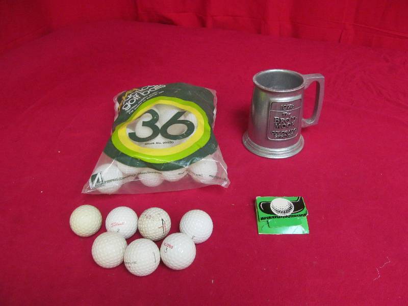golf balls, tees, pewter mug