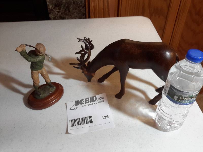 lot 126 image: Solid wood deer carvingWood Golfer carving..