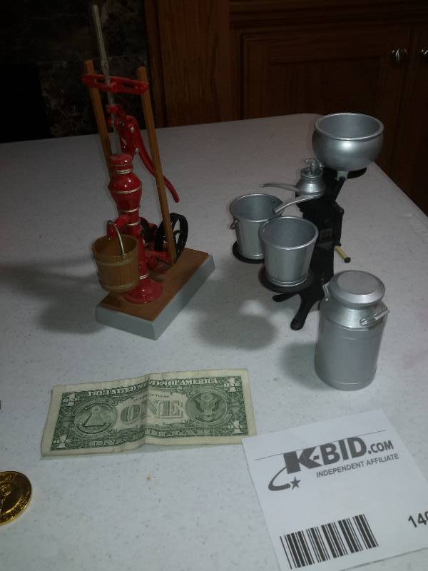 lot 140 image: Die Cast Pump Jack with pail  Cream Separator with pails and milk can