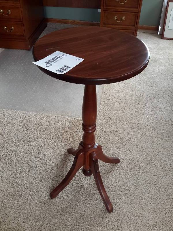 lot 13 image: Nice walnut accentside table.  Round.