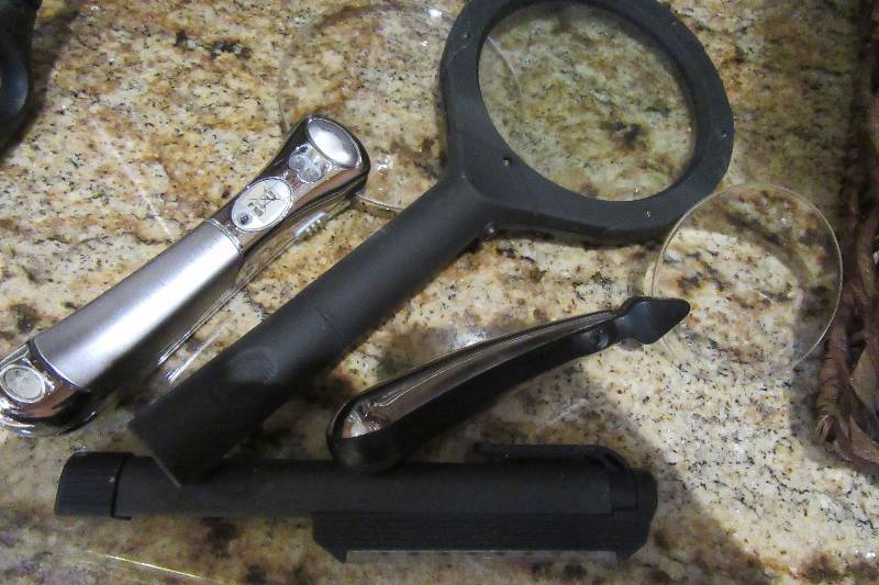 lot 85 image: Misc. notions as pictured.. Magnifying glass, flashlight, page magnifier