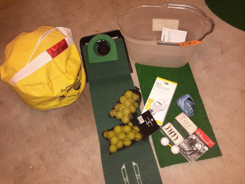 lot 240 image: Golf balls and practice putting system.