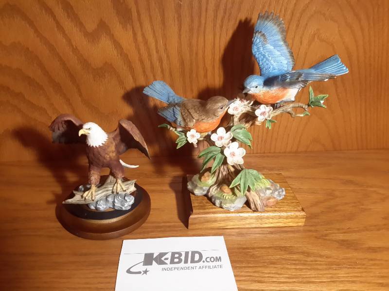 lot 176 image: Blue Bird statuettes and Bald Eagle Statue.