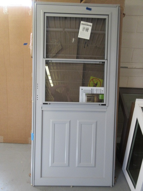 lot 225 image: ALMOST NEW STORM DOOR