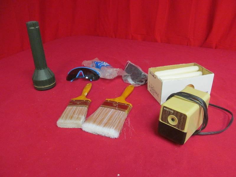 Coleman light, safety glasses, candles, paintbrushes