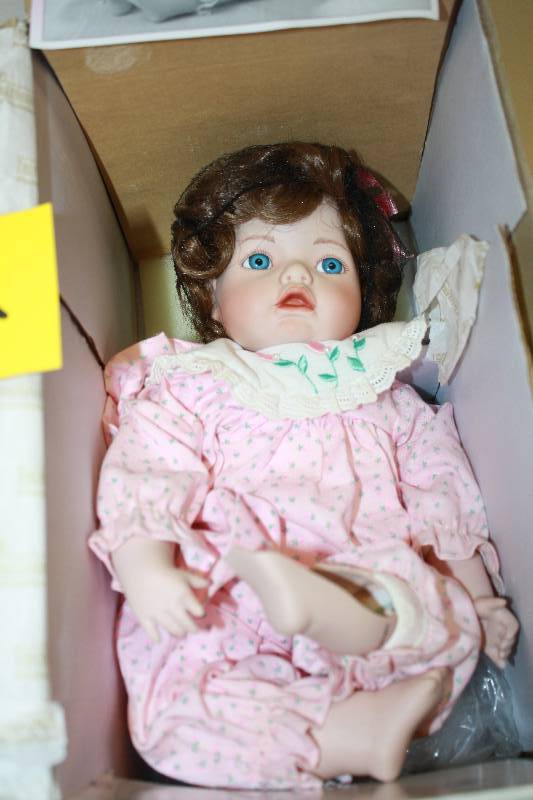 lot 252 image: Porcelain Doll With Broken Leg