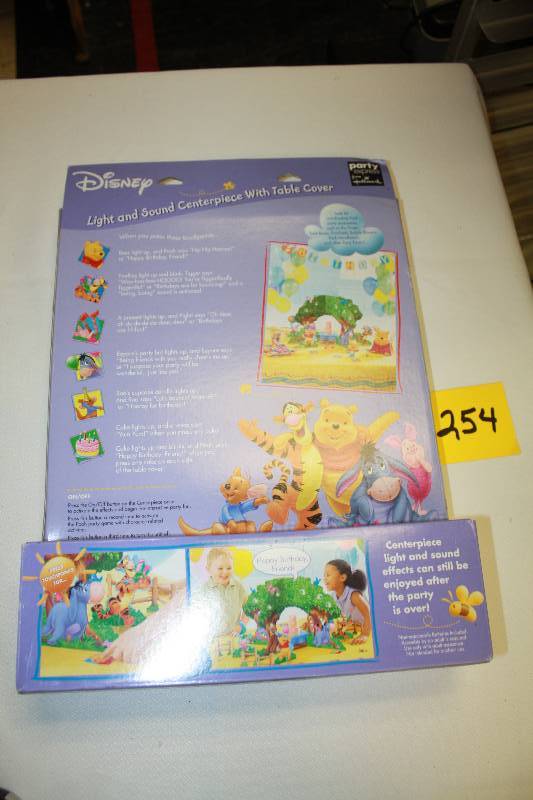 lot 254 image: Winnie the Pooh Light and Sound Centerpiece with Table Cover