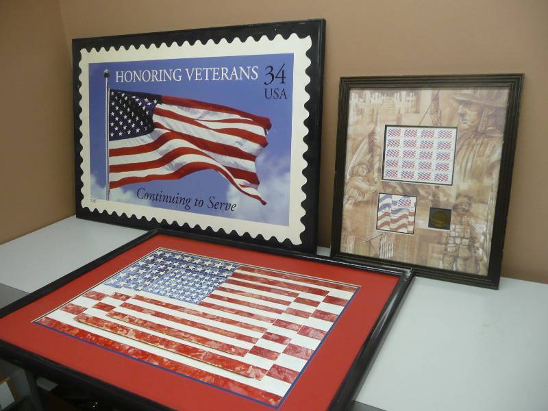 lot 38 image: AMERICA COLLECTION - HONORING THOSE WHO SERVED, #7722700 DESIGNED EXCLUSIVELY FOR THE USPO, FIRST DAY ISSUE - 17 BY 19 - HONORING VETERANS STAMP FRAMED 36 BY 24 - FRAMED FLAG ARTWORK 32 BY 24 - SEE PICTURES