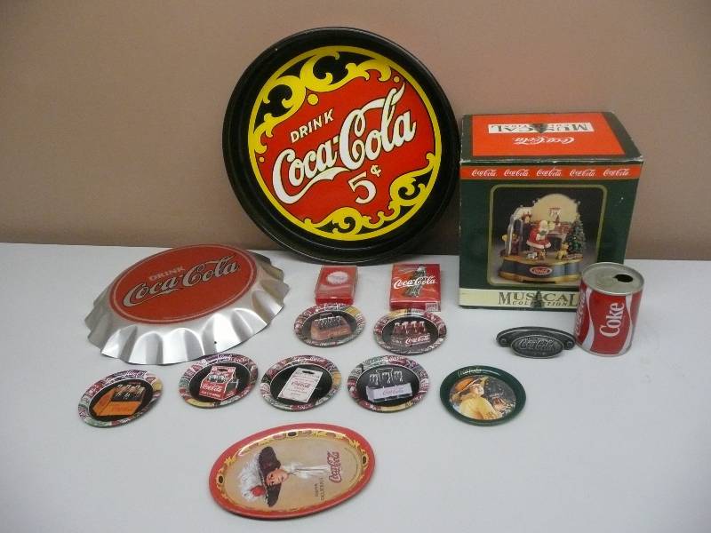 lot 42 image: VINTAGE COKE COLLECTION - MUSICAL SANTA, TRAY, BOTTLE CAP HANGING, CAN, HANDLE, COASTERS, CARDS, MINI TRAY ALL IN GOOD CONDITION SEE PICTURES